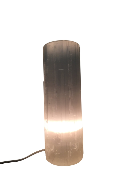 A selenite flat top crystal with a soft white glow