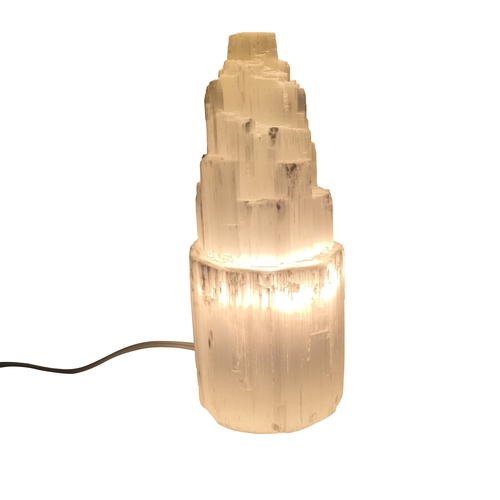 A selenite lamp casting a warm glow